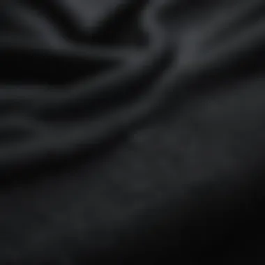 Fabric and Design Details of Black Nike Jumper Close-up of the fabric and design details of the black Nike jumper