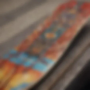 An artist customizing a skateboard deck with paint and tools.