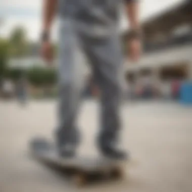 An urban skate park scene with skateboarders, emphasizing grey Dickies pants in action.