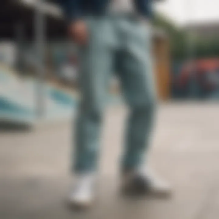 Adidas pants with buttons showcased in a skate park setting