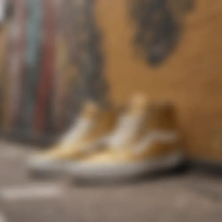 Artistic display of metallic gold Vans on a graffiti wall background