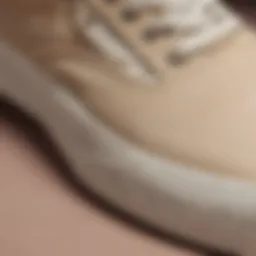 A close-up view of beige Vans showcasing their unique texture and design.