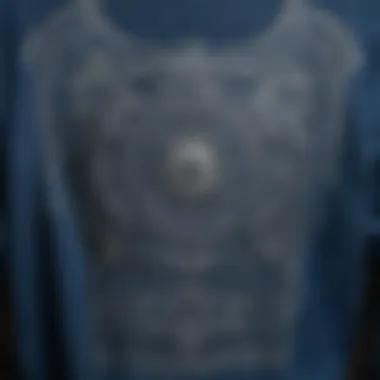 Close-up of the intricate design details on a blue graphic shirt