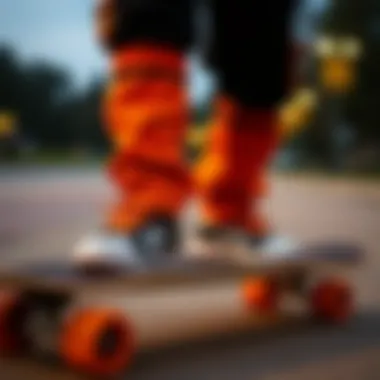 Vibrant orange and black joggers showcased on a skateboard.