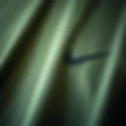 Close-up of olive green Nike T-shirt fabric texture