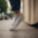 Vans white leopard print skate shoes on a skateboard