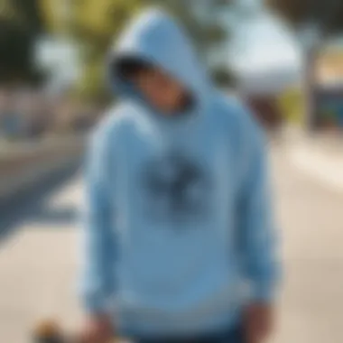 Light blue pullover hoodie in a skateboard park