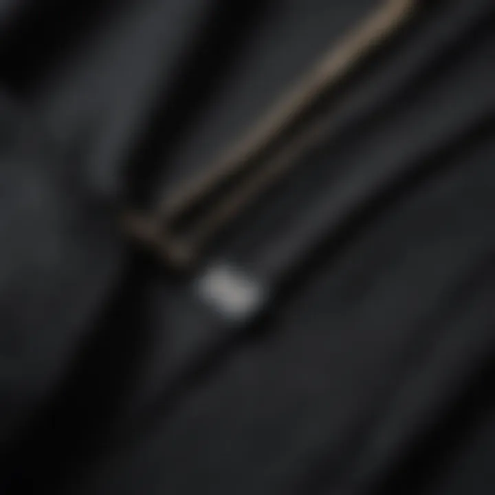 Close-up of the fabric detail of a black zip-up sweatshirt