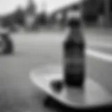 Stylish black and white water bottle resting on a skateboard