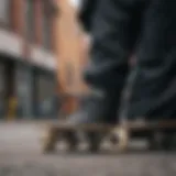 A close-up of a black flannel jacket draped over a skateboard