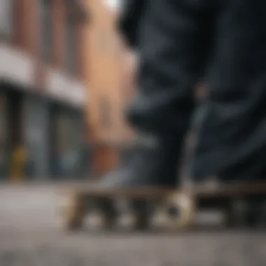 A close-up of a black flannel jacket draped over a skateboard