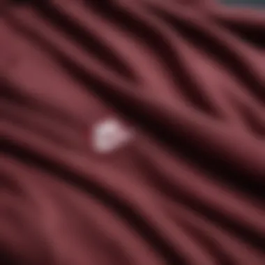 Close-up of burgundy Nike hoodie showcasing fabric texture