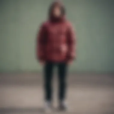 Skateboarder wearing a burgundy puffer jacket