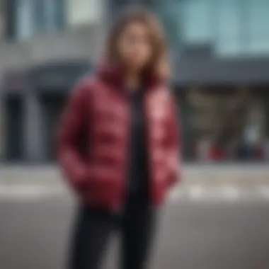 Stylish individual wearing a burgundy puffer jacket in an urban setting, highlighting its versatility.