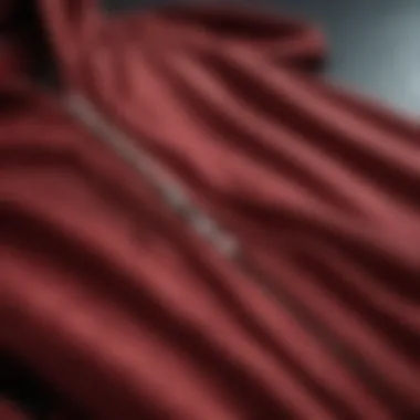 Close-up of the fabric texture of a dark red zip-up hoodie