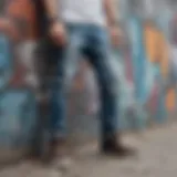 A pair of stylish ripped jeans displayed against a graffiti wall