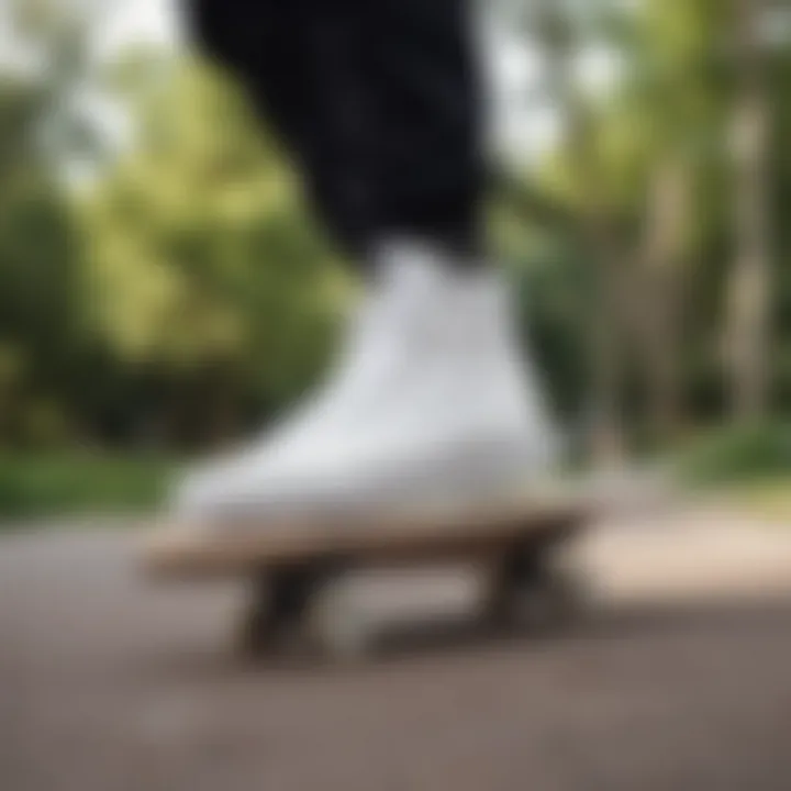 A skateboarder wearing true white high top Vans in a park