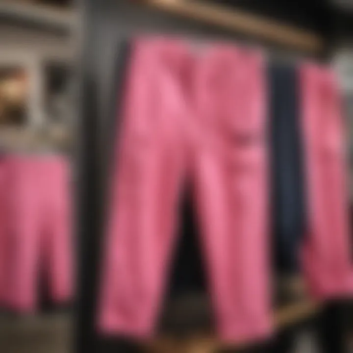 A collection of pink army fatigue pants displayed in a trendy skate shop.