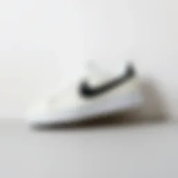 Stylish white Nike shoes with black Swoosh against a minimalist background